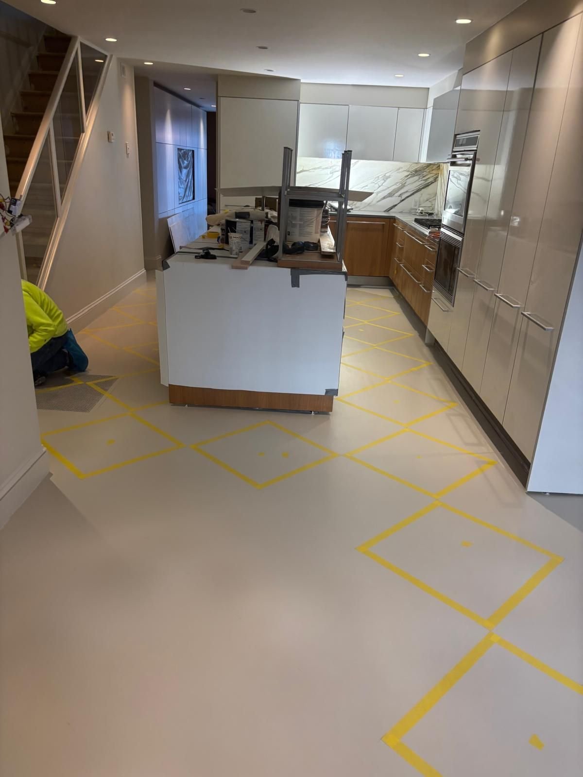 Kitchen floor taped out for a custom painted pattern
