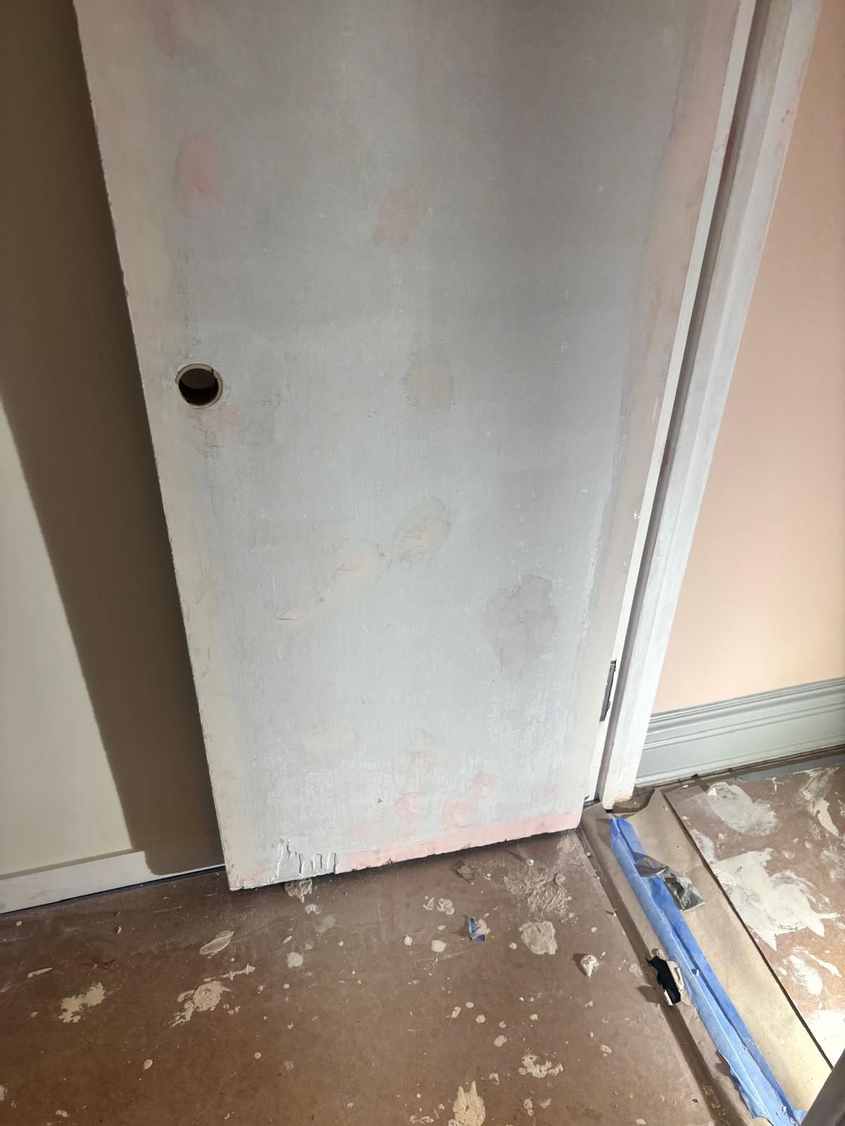 Door patched and sanded before painting